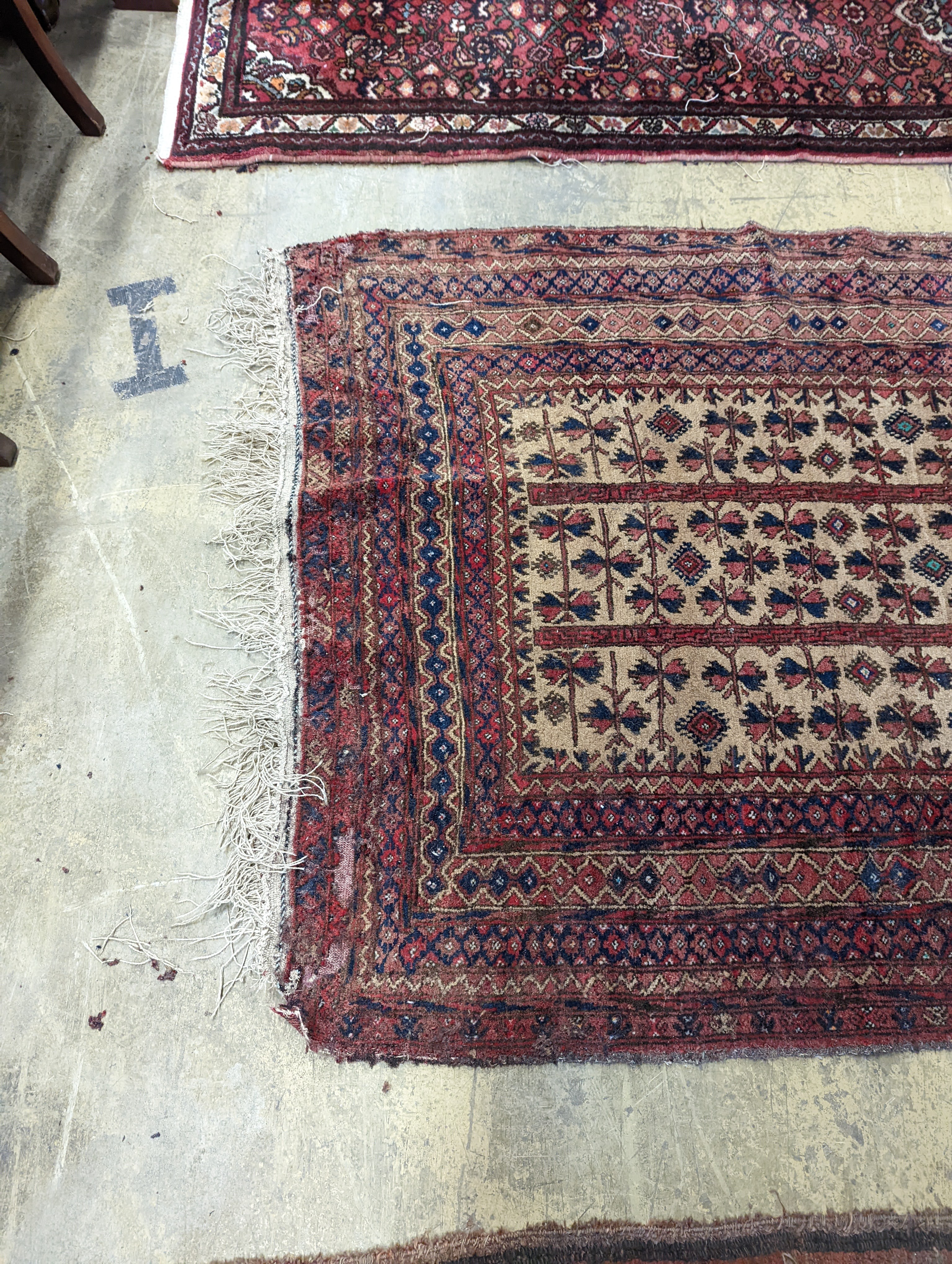 An antique Caucasian runner and a Belouch rug, larger 284 x 134cm